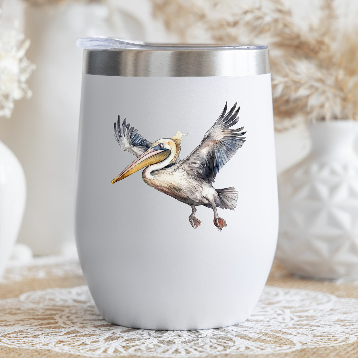 Pelican Taking Flight UV DTF sticker applied to a stemless wine glass