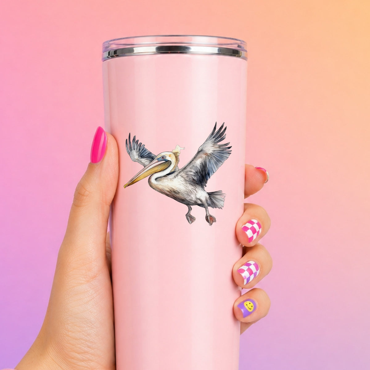 Pelican Taking Flight UV DTF sticker applied to a pink tumbler