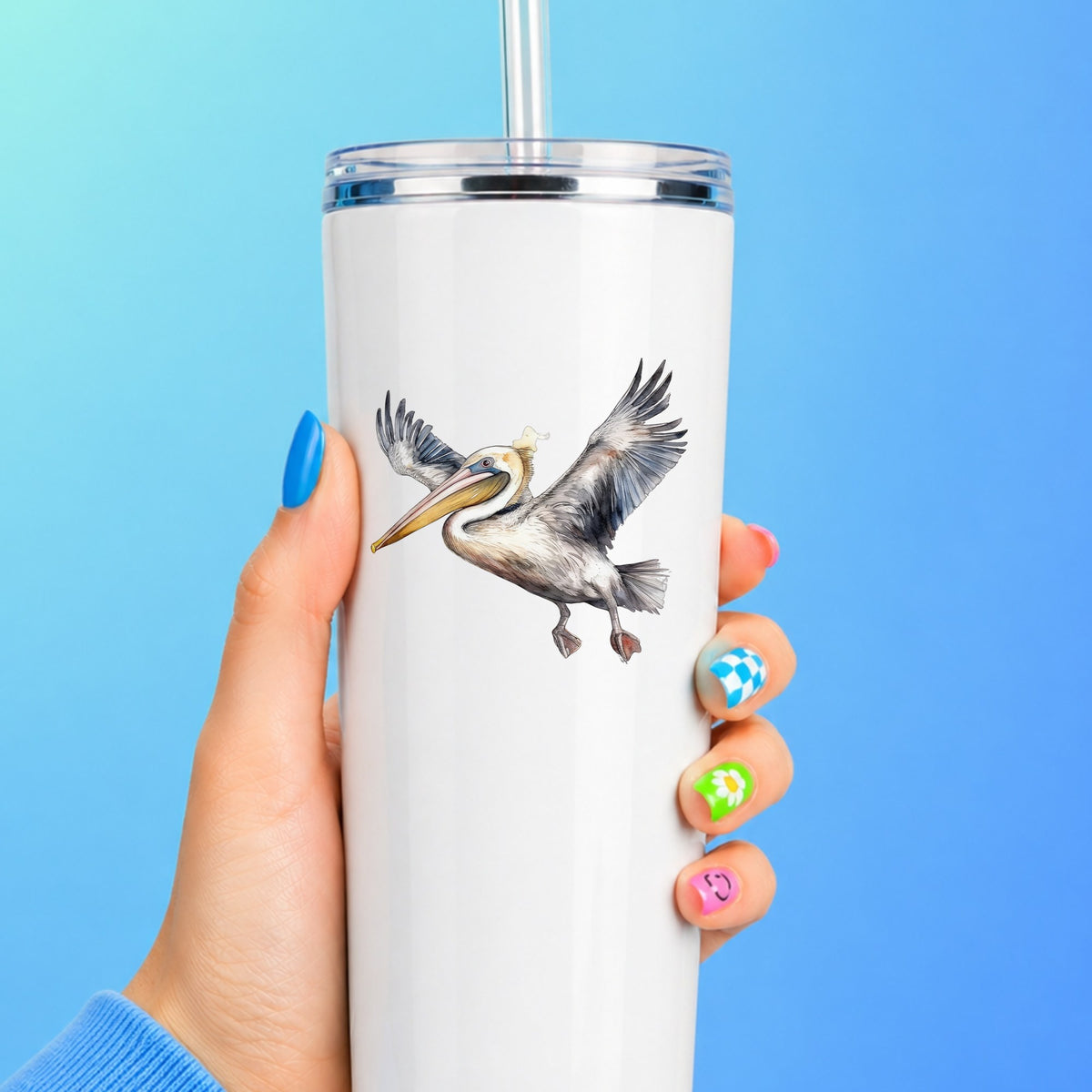 Pelican Taking Flight UV DTF sticker applied to a white tumbler