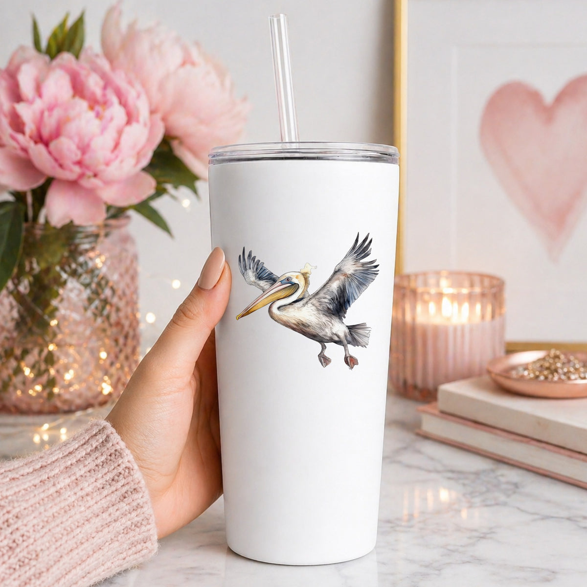 Pelican Taking Flight UV DTF sticker applied to a white tumbler