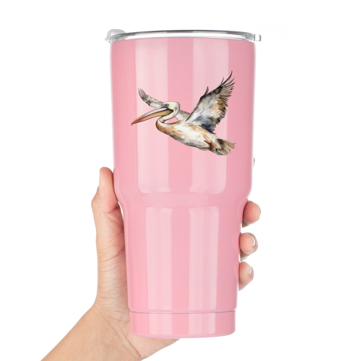 Coastal Pelican In Flight UV DTF sticker applied to a pink tumbler