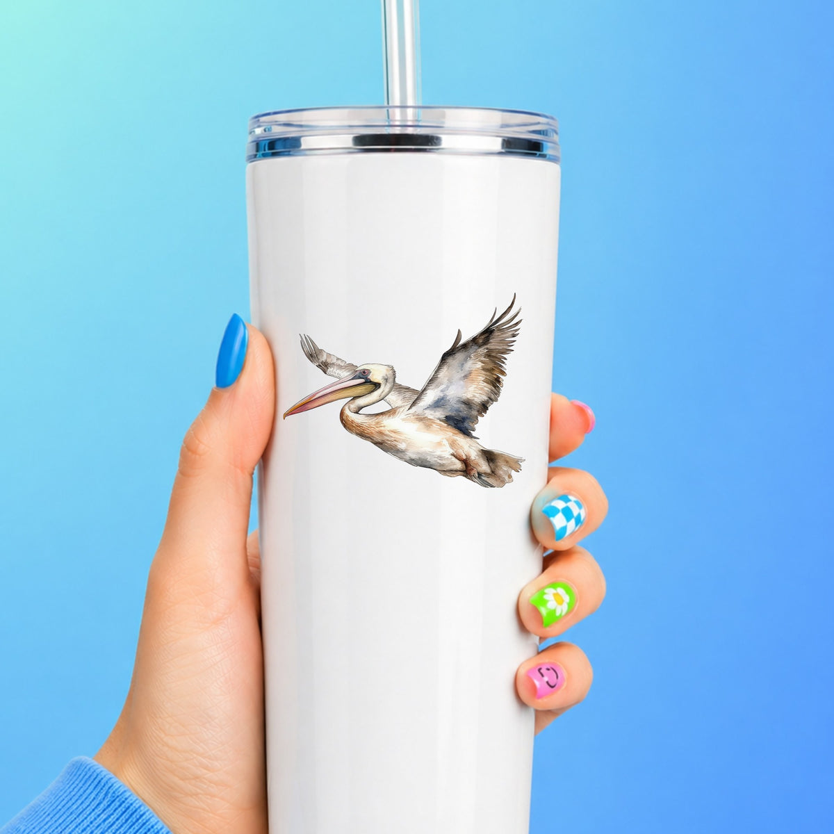 Coastal Pelican In Flight UV DTF sticker applied to a white tumbler