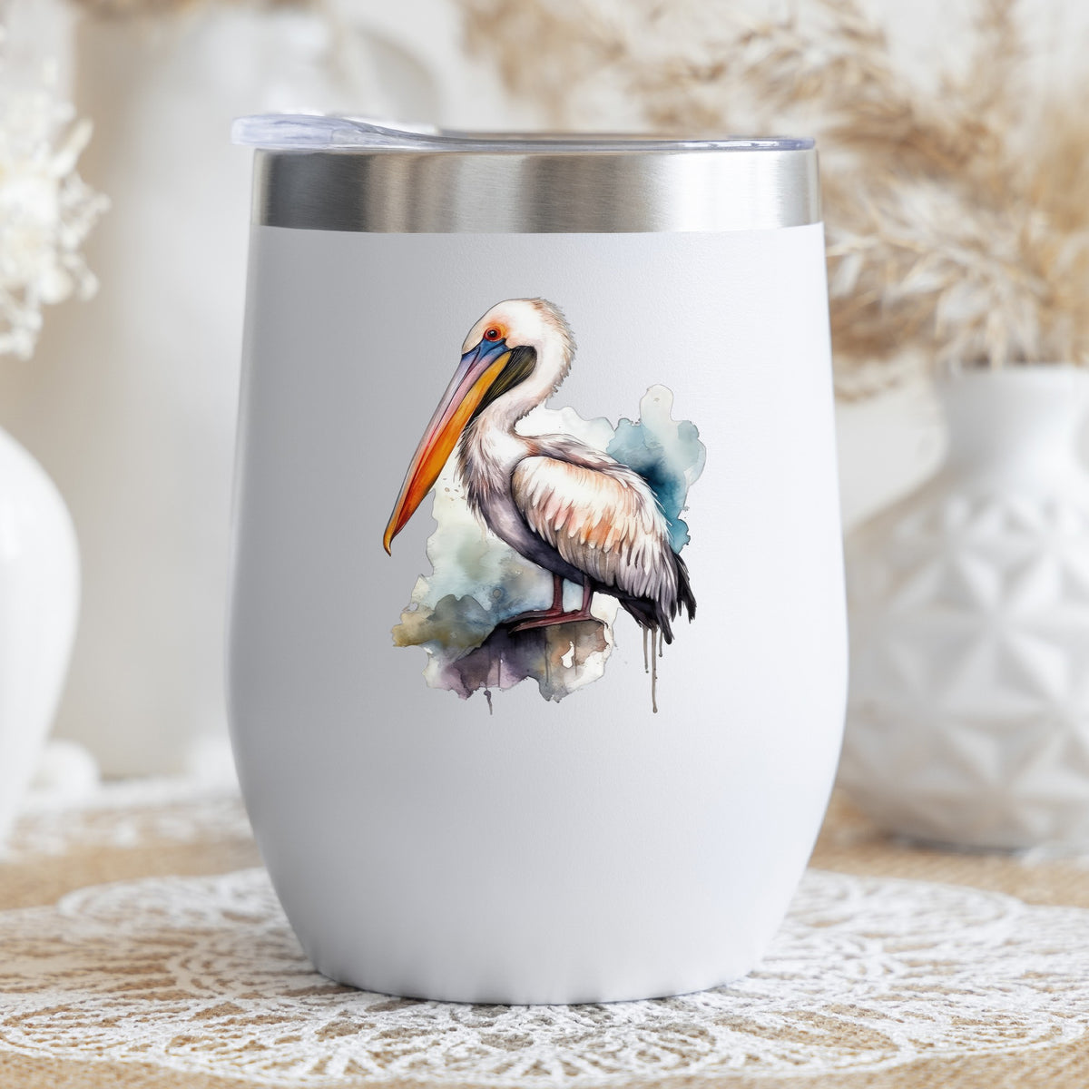 Teal Splash Pelican UV DTF sticker applied to a stemless wine glass