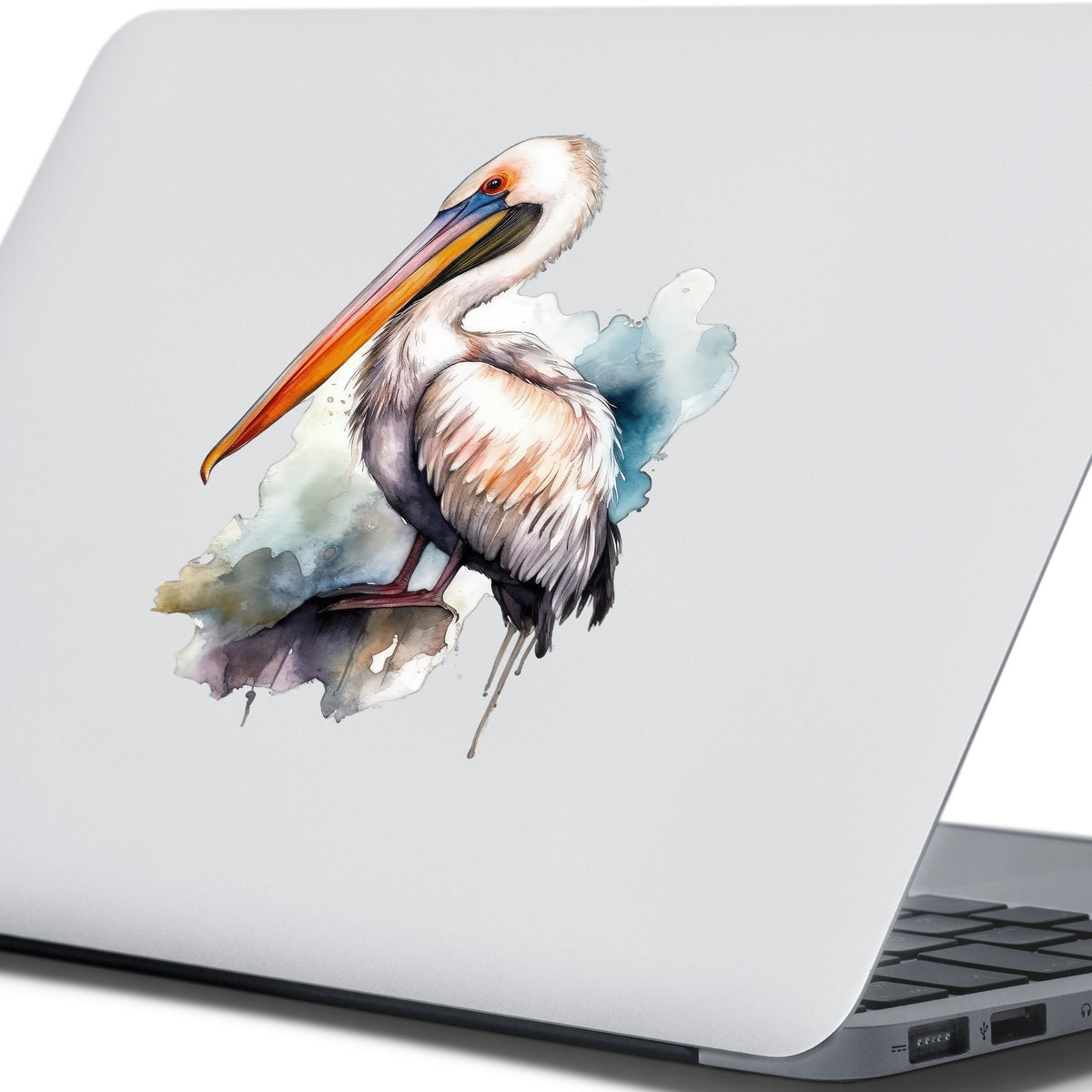 Teal Splash Pelican UV DTF sticker applied to a laptop