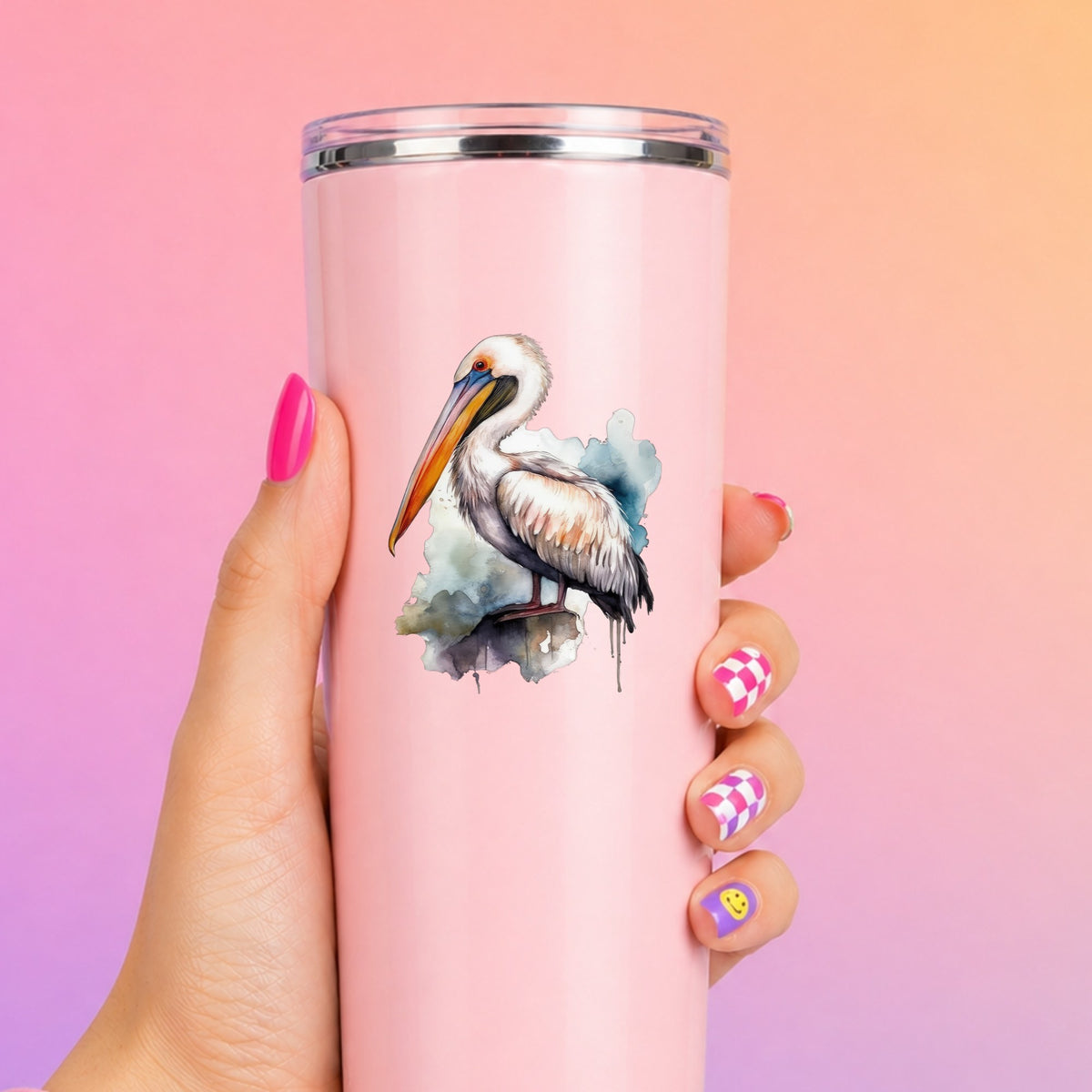 Teal Splash Pelican UV DTF sticker applied to a pink tumbler