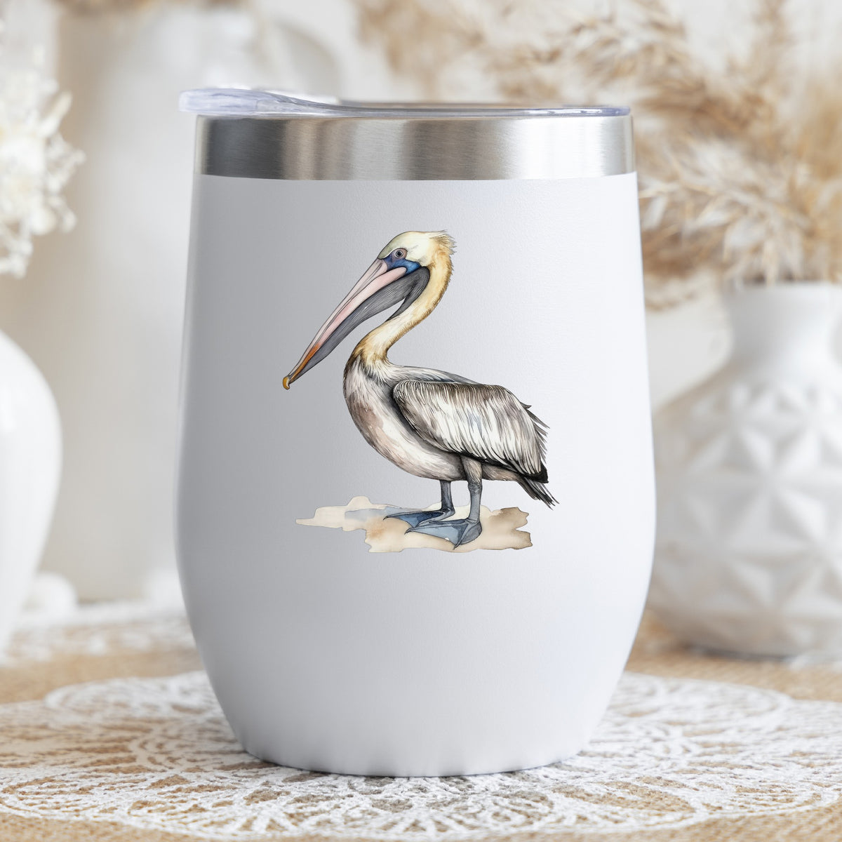 Pelican On Sand UV DTF sticker applied to a stemless wine glass