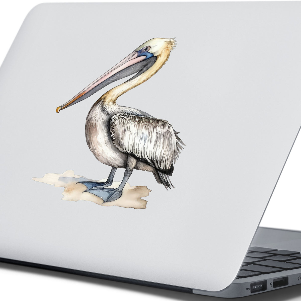 Pelican On Sand UV DTF sticker applied to a laptop