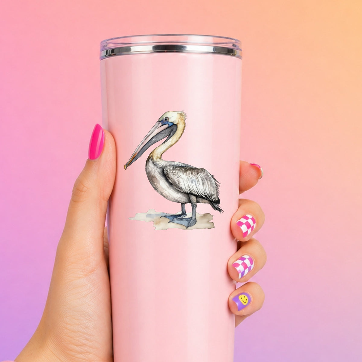 Pelican On Sand UV DTF sticker applied to a pink tumbler