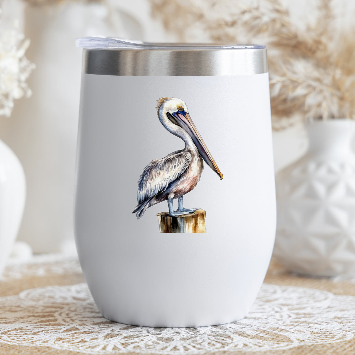 Pelican On Wood Post UV DTF sticker applied to a stemless wine glass