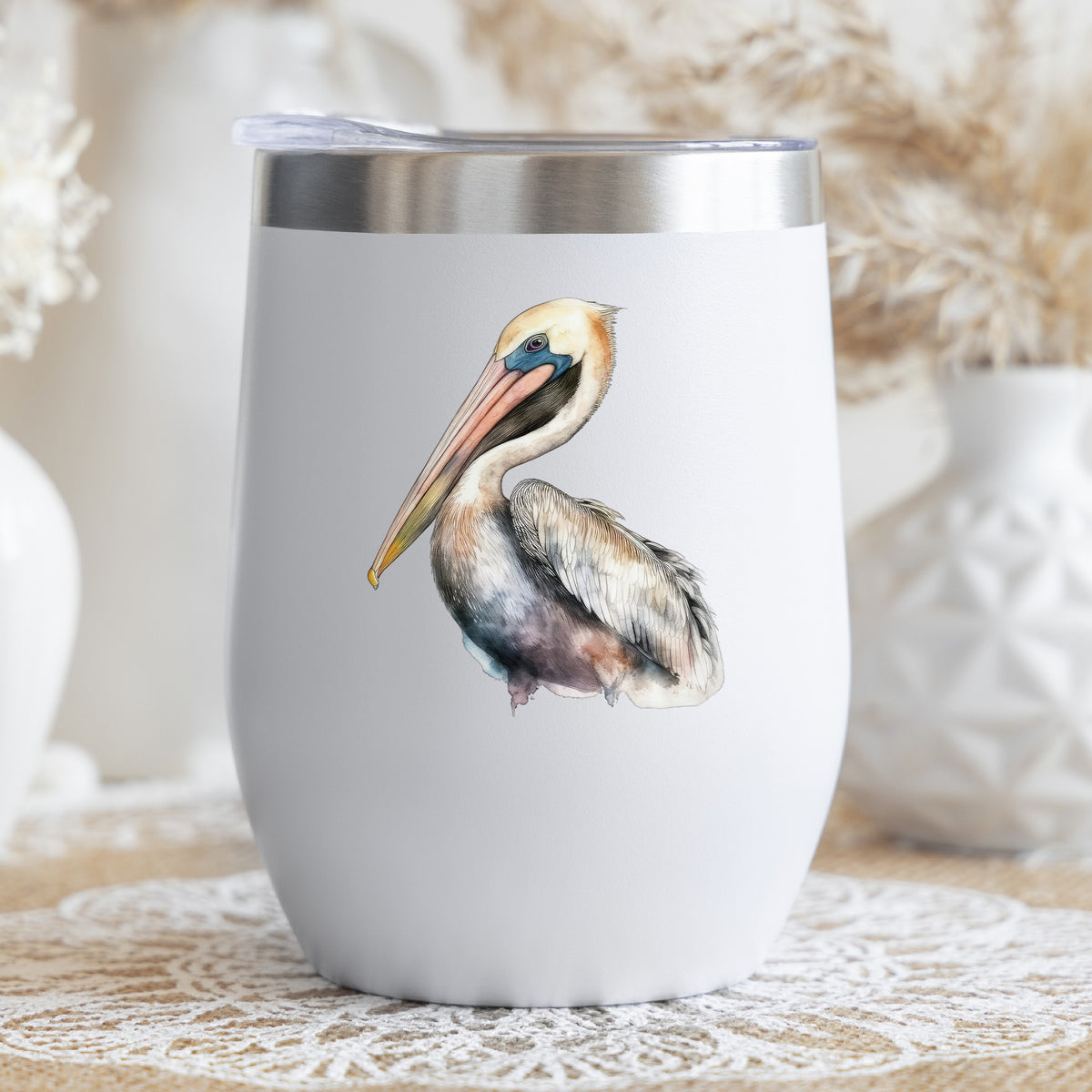 Standing Pelican UV DTF sticker applied to a stemless wine glass