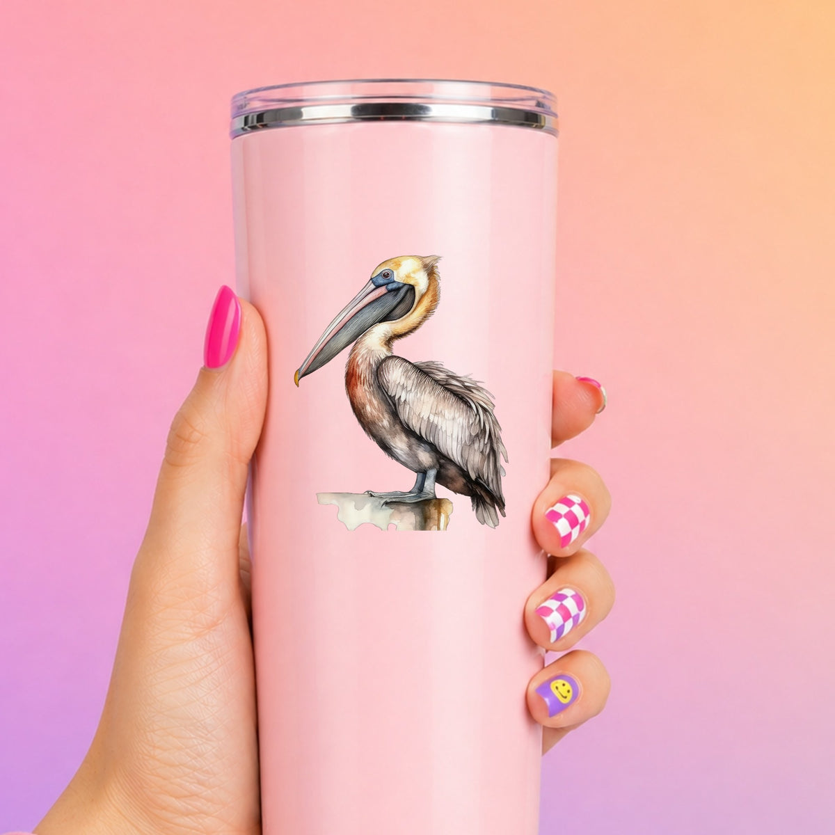 Golden Head Pelican UV DTF sticker applied to a pink tumbler