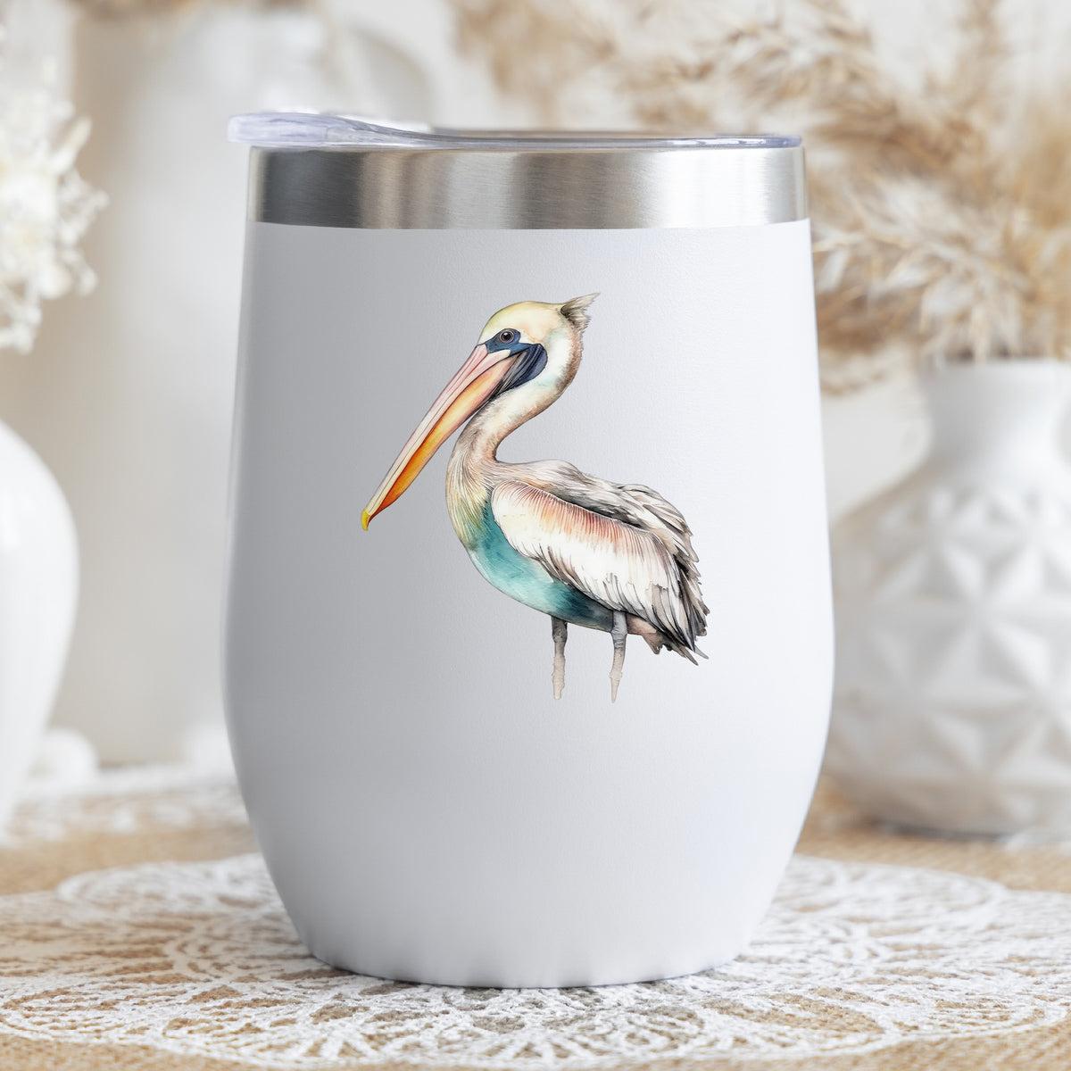 Turquoise Pelican UV DTF sticker applied to a stemless wine glass