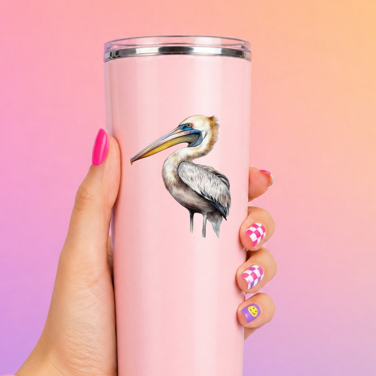 Striding Pelican UV DTF sticker applied to a pink tumbler