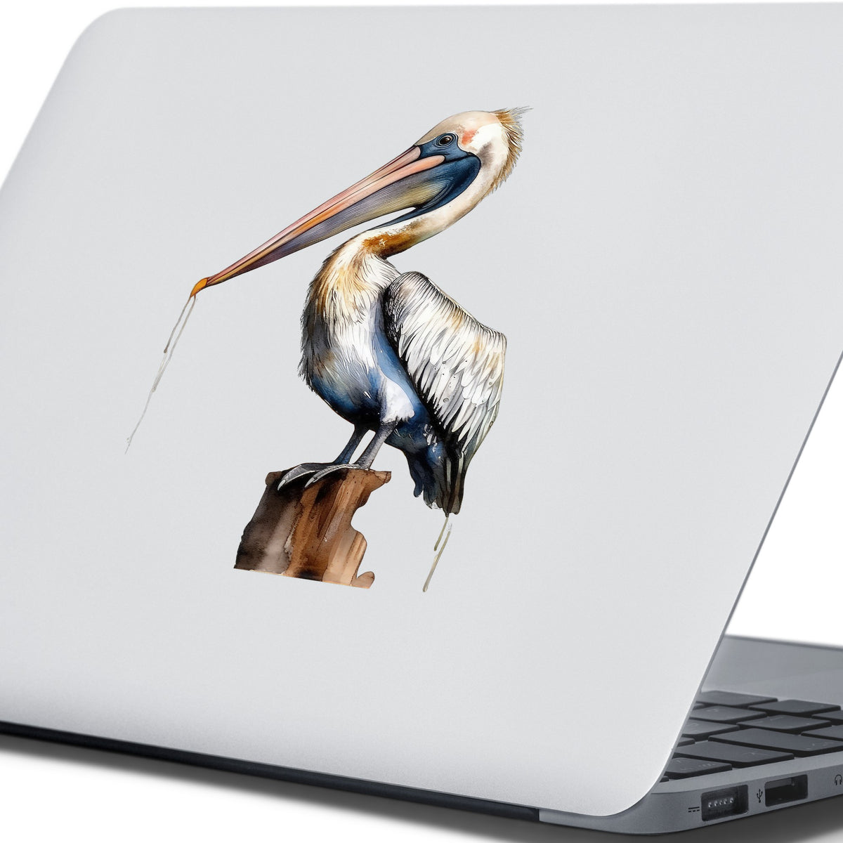 Pelican Perched On Piling UV DTF sticker applied to a laptop