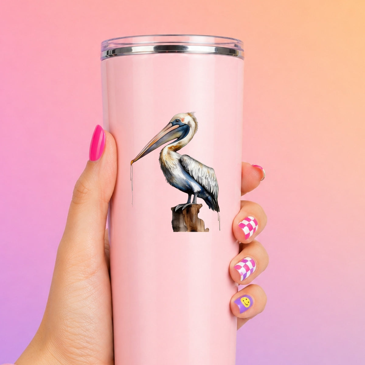 Pelican Perched On Piling UV DTF sticker applied to a pink tumbler