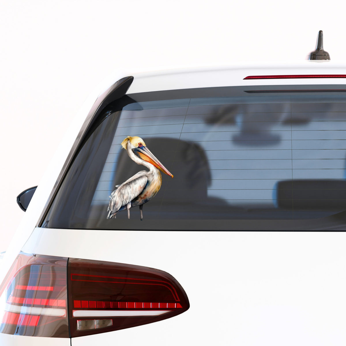 Yellow Crest Pelican UV DTF sticker applied to a car window