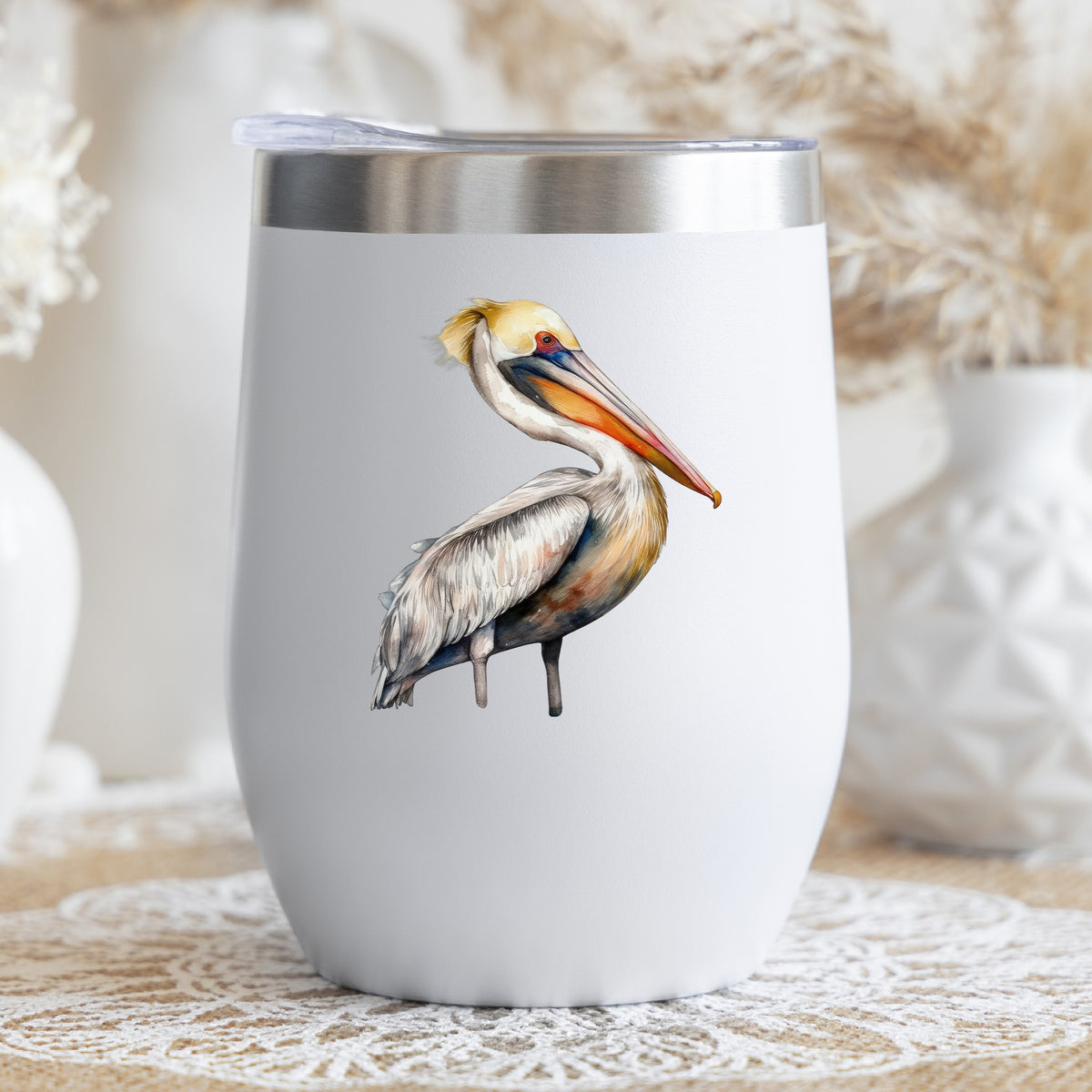 Yellow Crest Pelican UV DTF sticker applied to a stemless wine glass