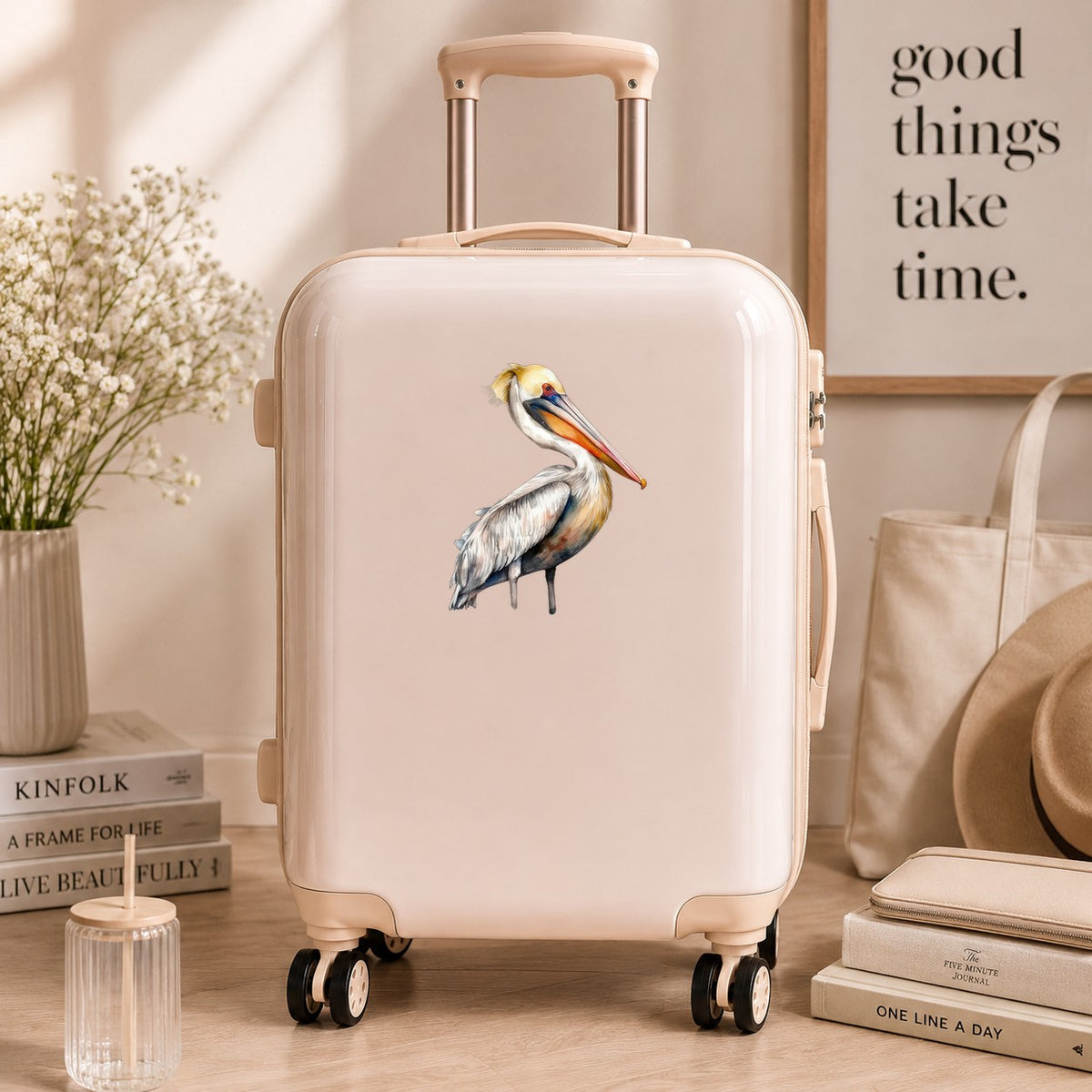 Yellow Crest Pelican UV DTF sticker applied to a neutral suitcase