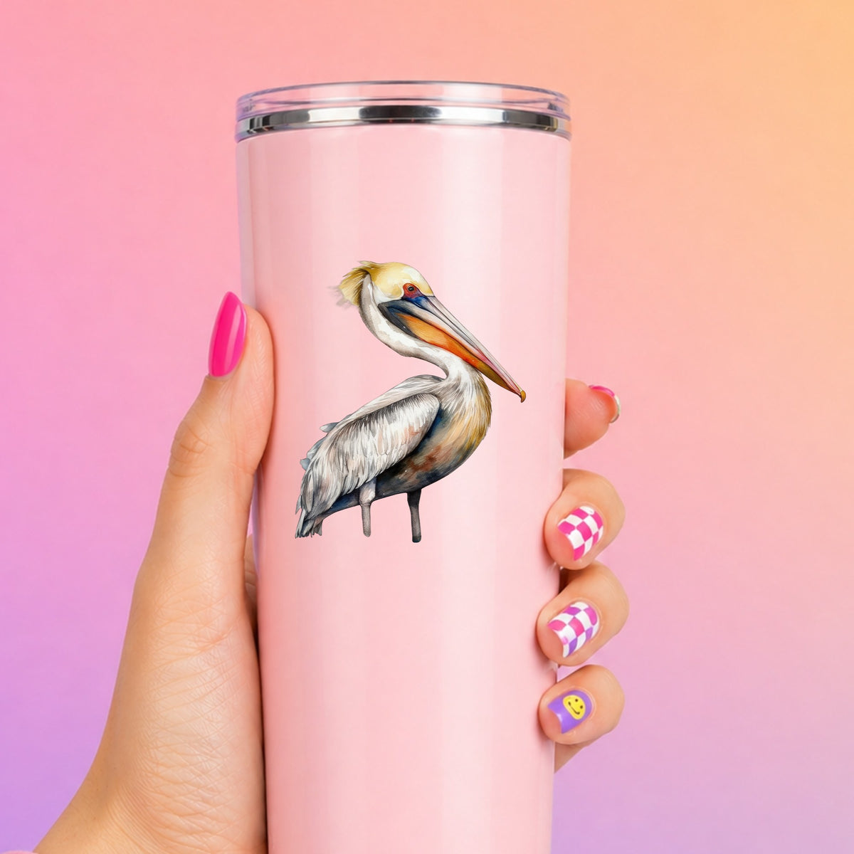 Yellow Crest Pelican UV DTF sticker applied to a pink tumbler