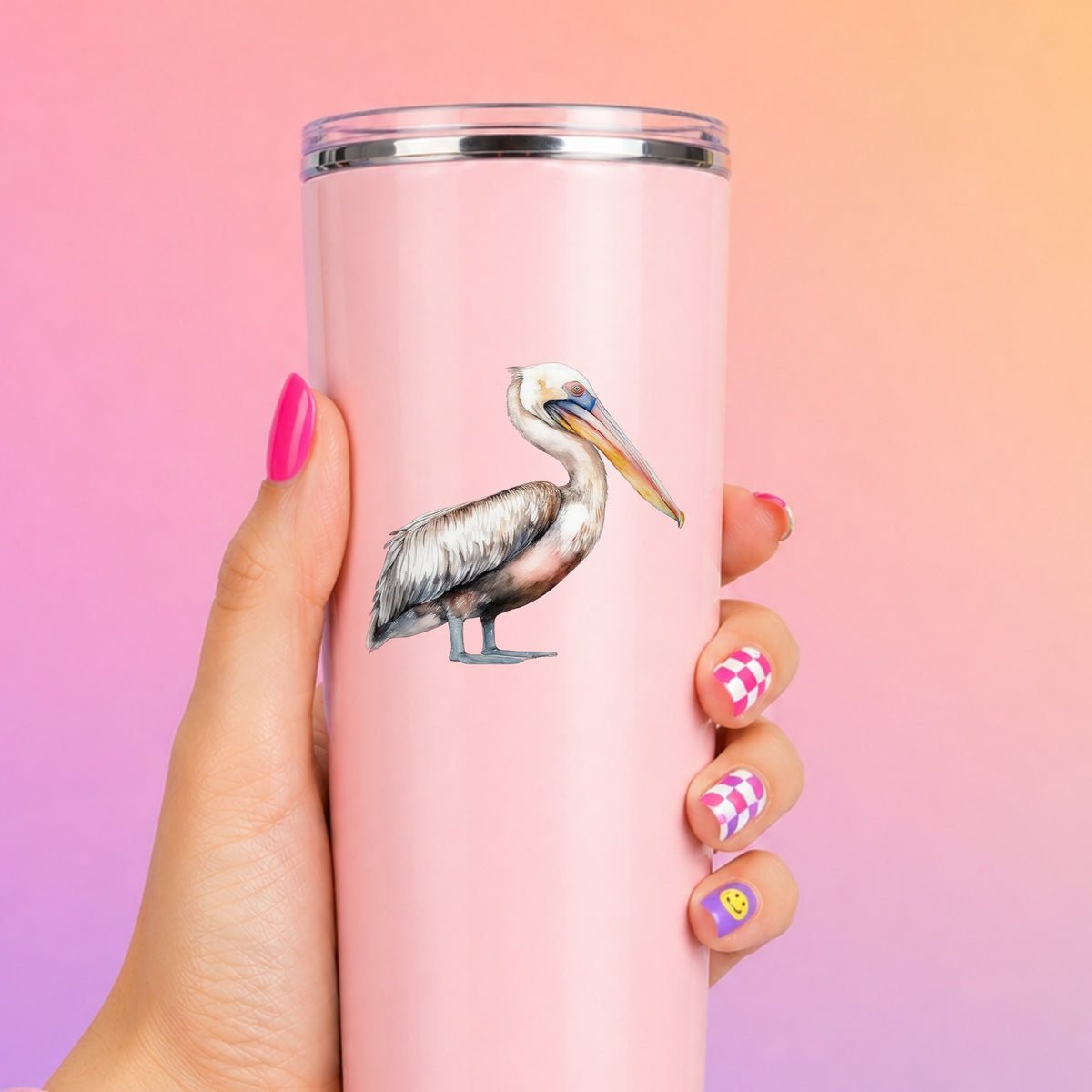 Walking Pelican UV DTF sticker applied to a pink tumbler