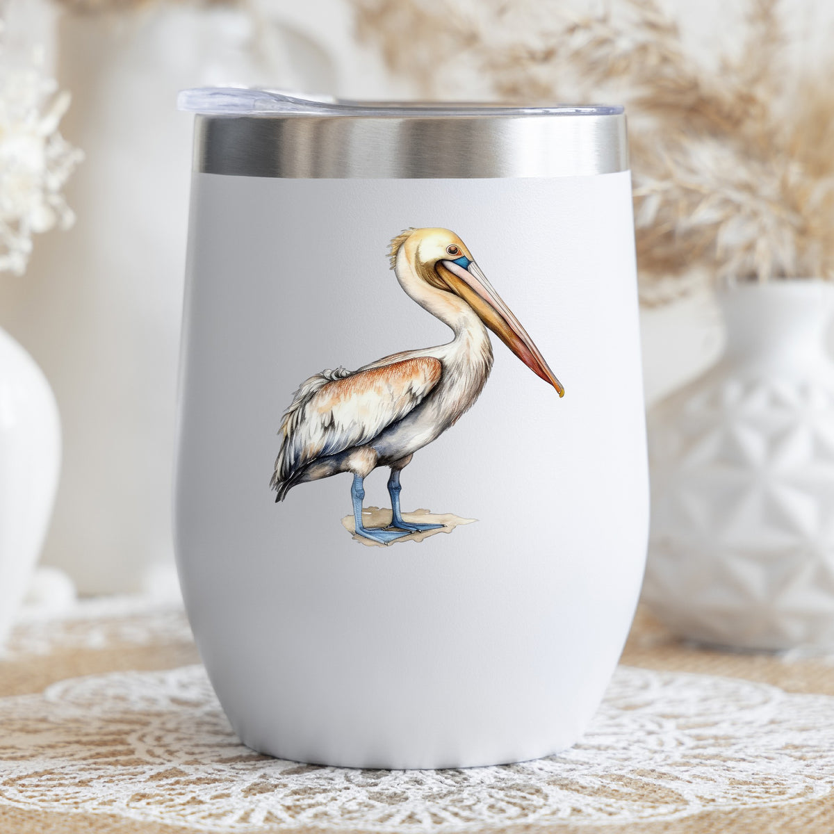 Rust Wing Pelican UV DTF sticker applied to a stemless wine glass
