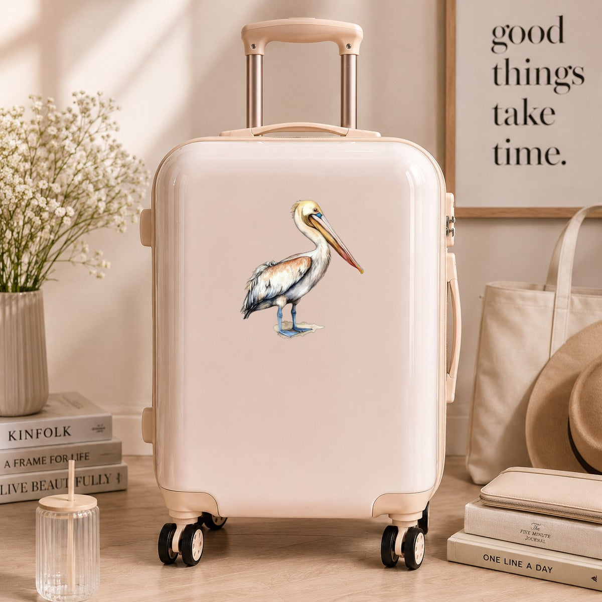 Rust Wing Pelican UV DTF sticker applied to a neutral suitcase