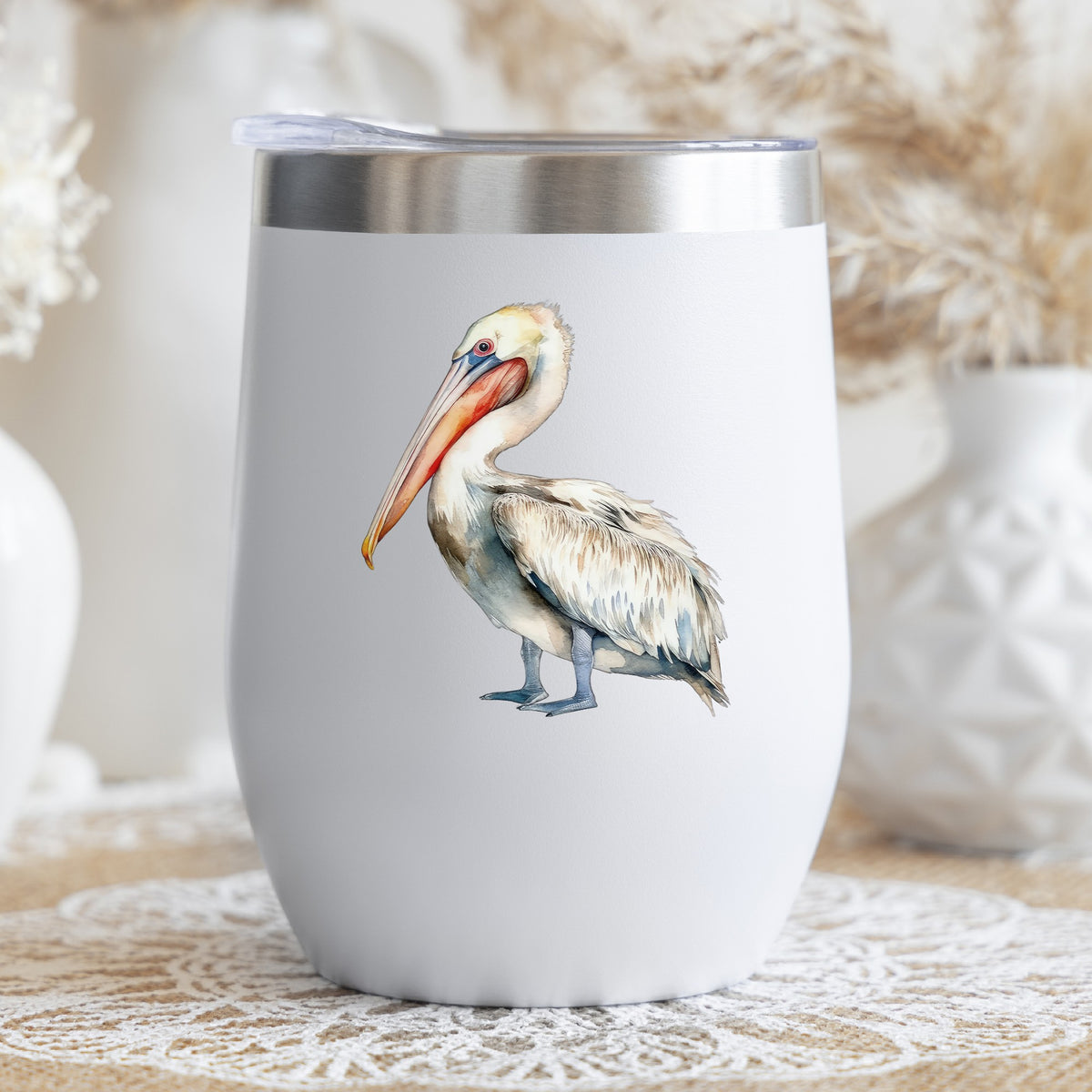 Cream And Orange Pelican UV DTF sticker applied to a stemless wine glass