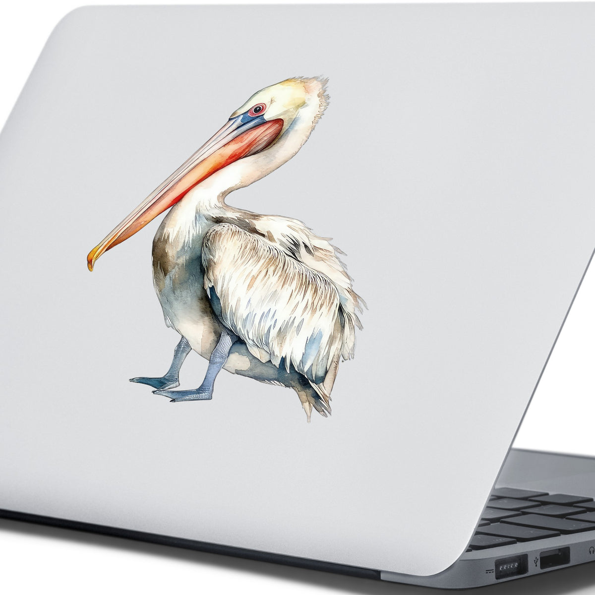 Cream And Orange Pelican UV DTF sticker applied to a laptop