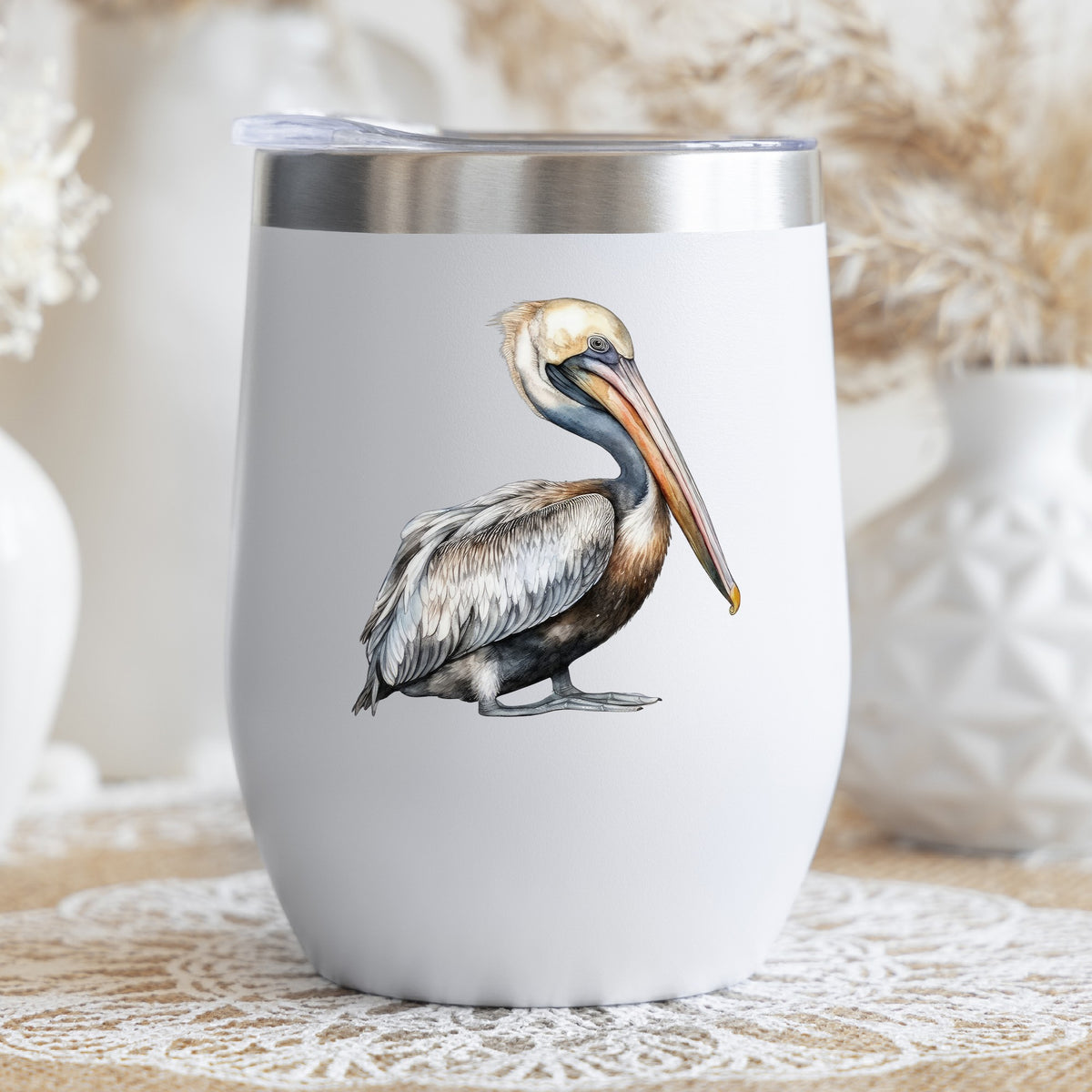 Gray Standing Pelican UV DTF sticker applied to a stemless wine glass