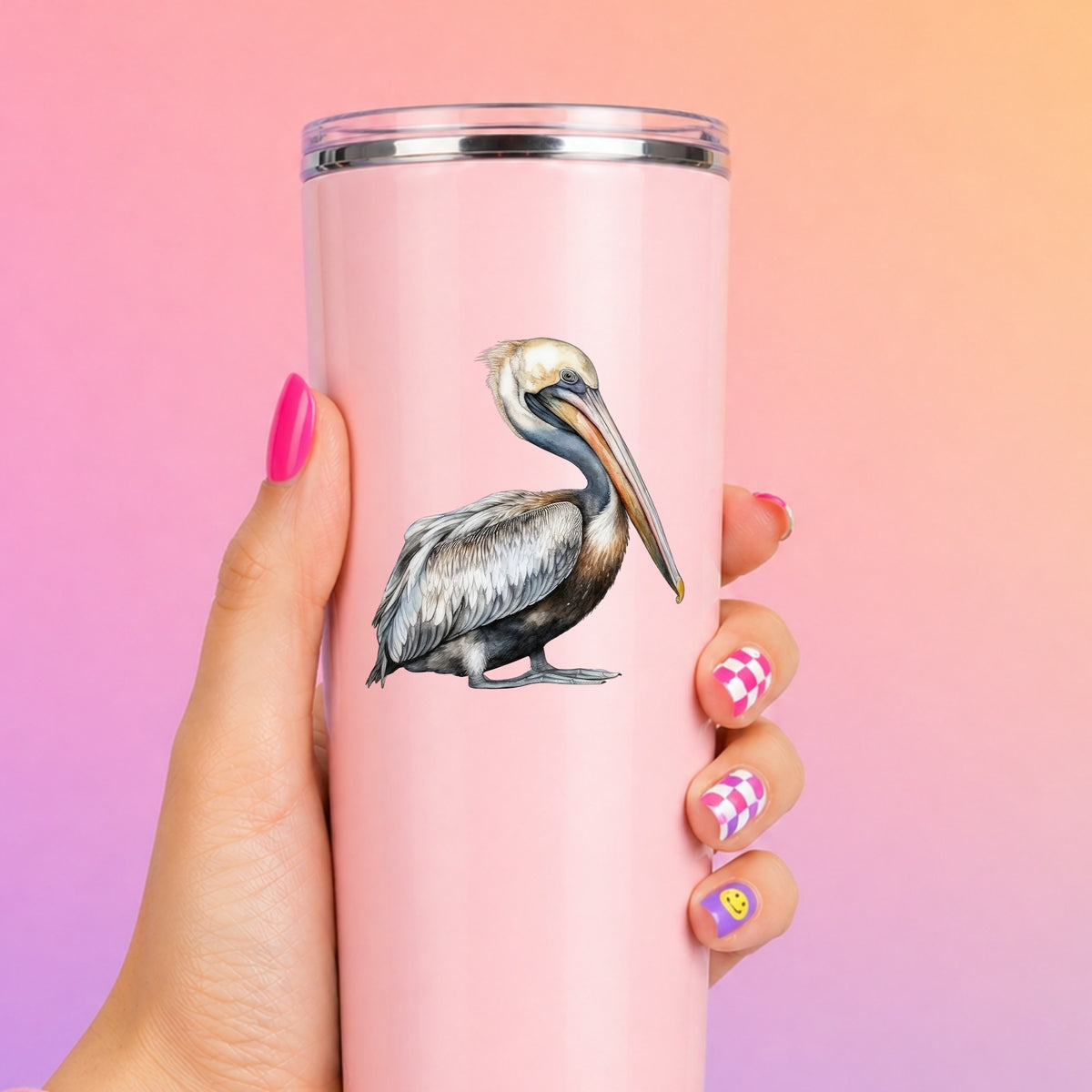Gray Standing Pelican UV DTF sticker applied to a pink tumbler