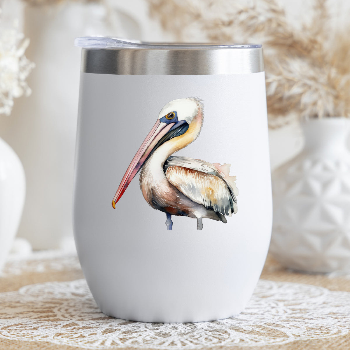 Pink Beak Pelican UV DTF sticker applied to a stemless wine glass