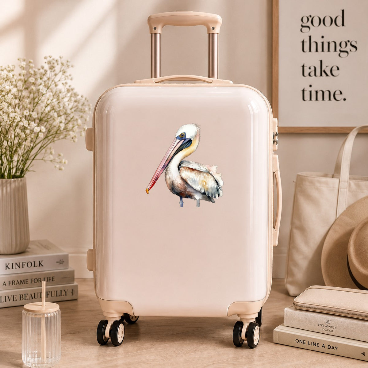 Pink Beak Pelican UV DTF sticker applied to a neutral suitcase