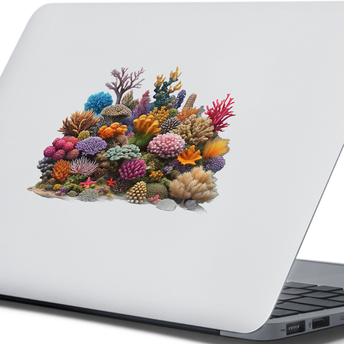 Colorful Coral Reef UV DTF sticker applied to the lid of a silver laptop