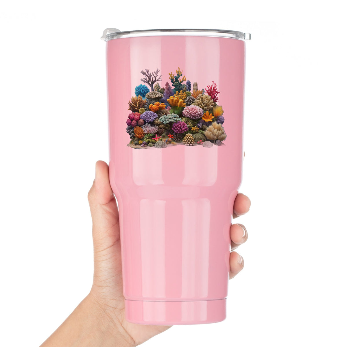 Colorful Coral Reef UV DTF sticker applied to a pink tumbler held against a white background