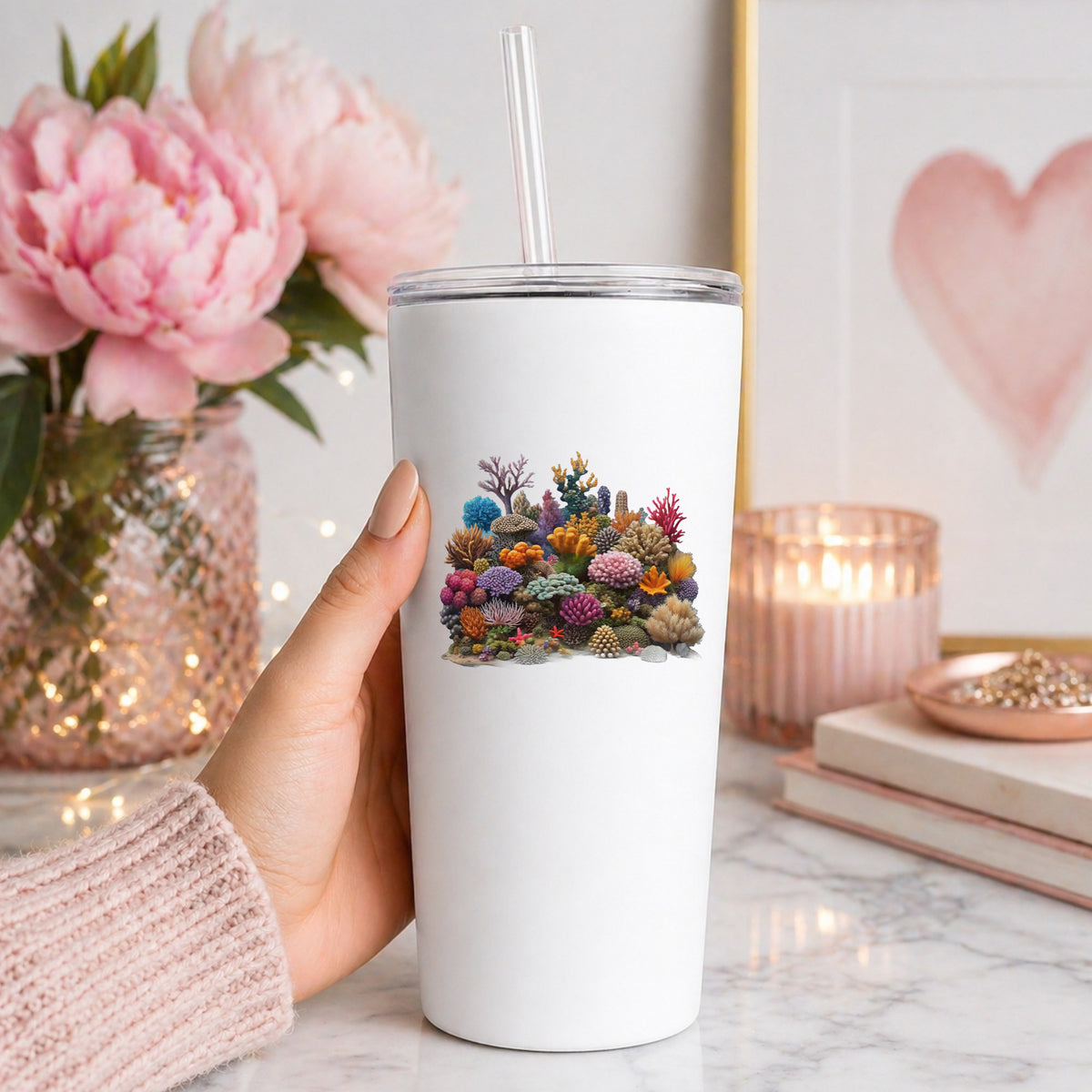 Colorful Coral Reef UV DTF sticker applied to a white straw tumbler beside pink peonies