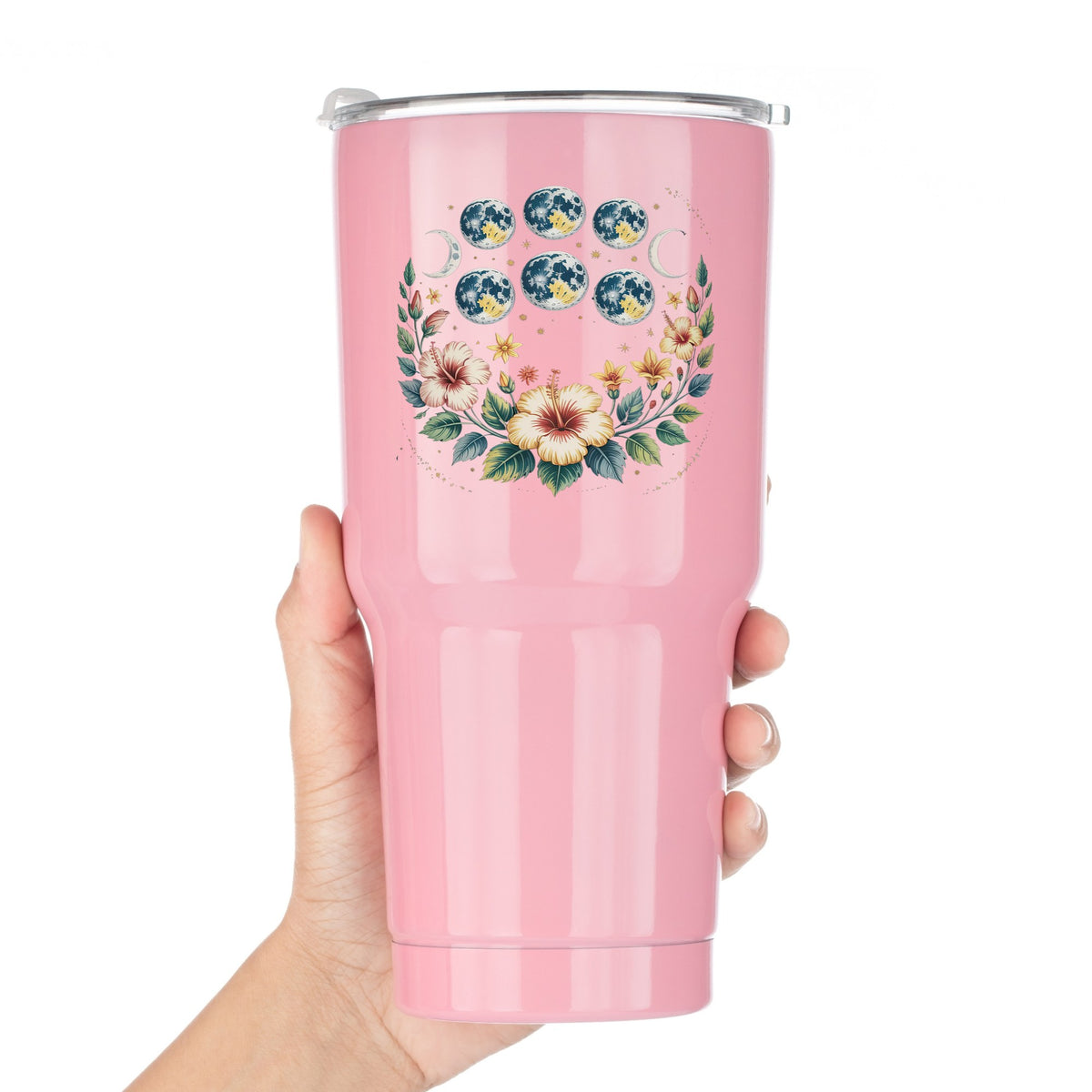 Moon Phases With Hibiscus Flowers UV DTF sticker applied to a pink tumbler held against a white background