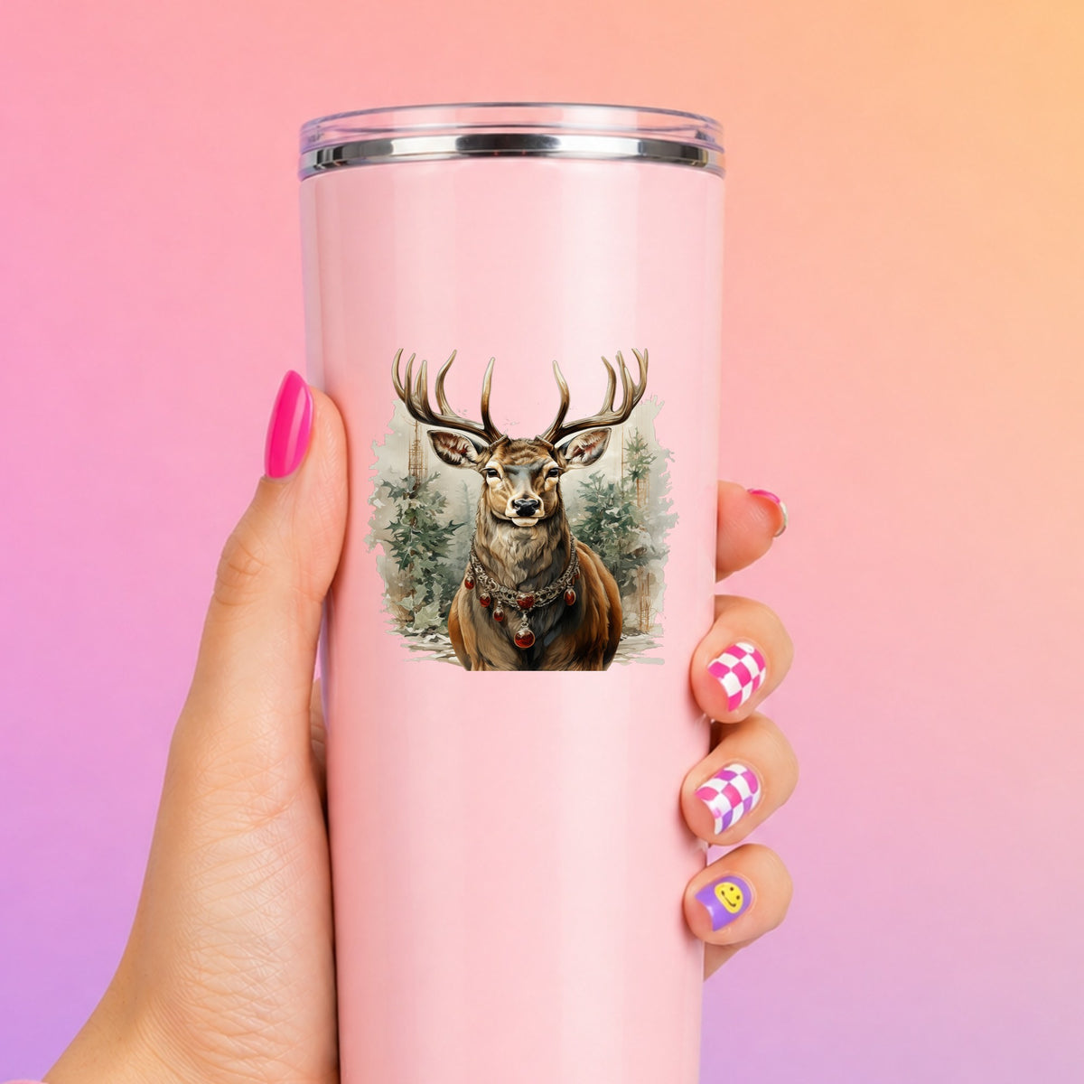 Stag With Jeweled Necklace UV DTF sticker applied to a tall pink tumbler on a pink and orange background