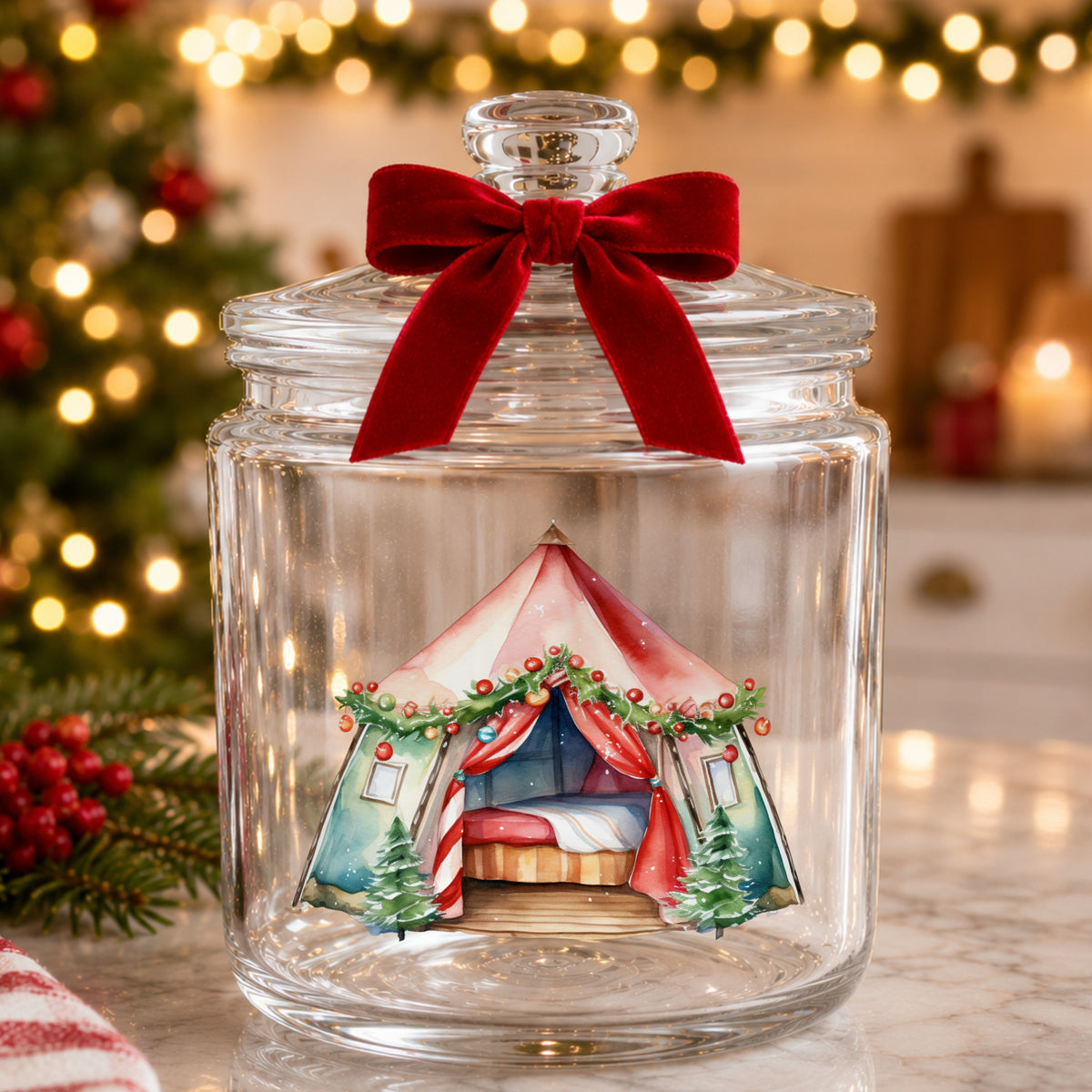 Christmas Glamping Tent UV DTF sticker applied to a glass candy jar tied with a red bow