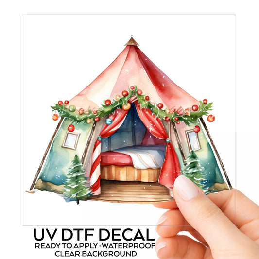 Christmas Glamping Tent UV DTF sticker on its backing card, held in hand