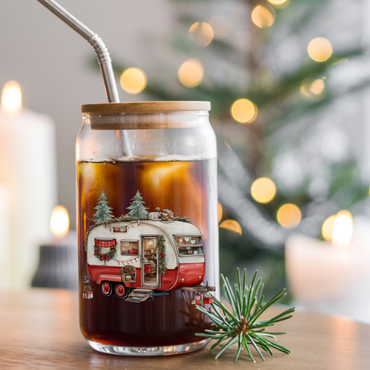 Vintage Christmas Camper Trailer UV DTF sticker applied to a glass can cup of iced coffee with a straw
