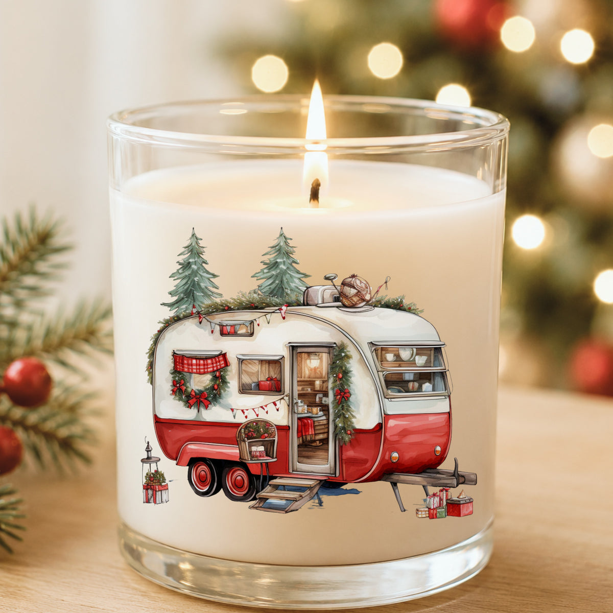 Vintage Christmas Camper Trailer UV DTF sticker applied to a white candle in a glass holder near Christmas lights