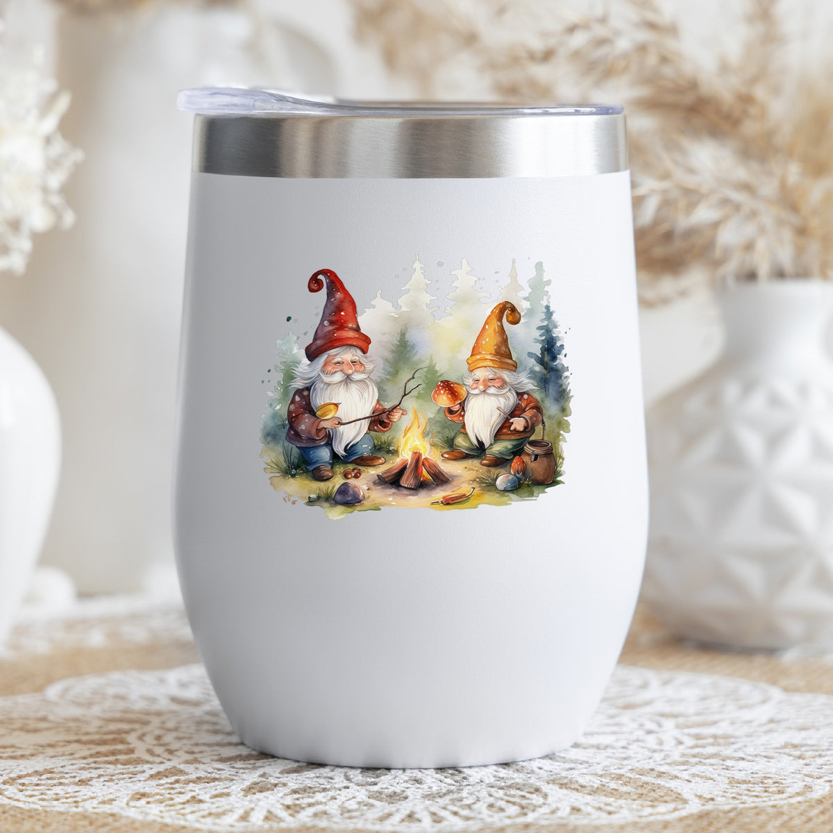 Gnomes At A Campfire UV DTF sticker applied to a white stemless tumbler with a lid
