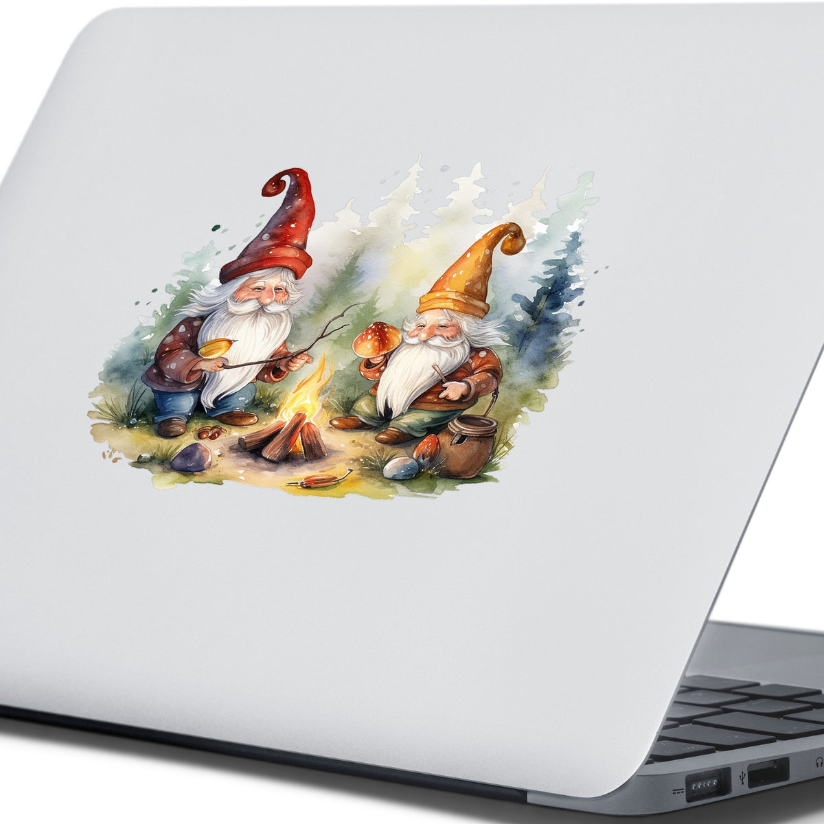 Gnomes At A Campfire UV DTF sticker applied to the lid of a silver laptop