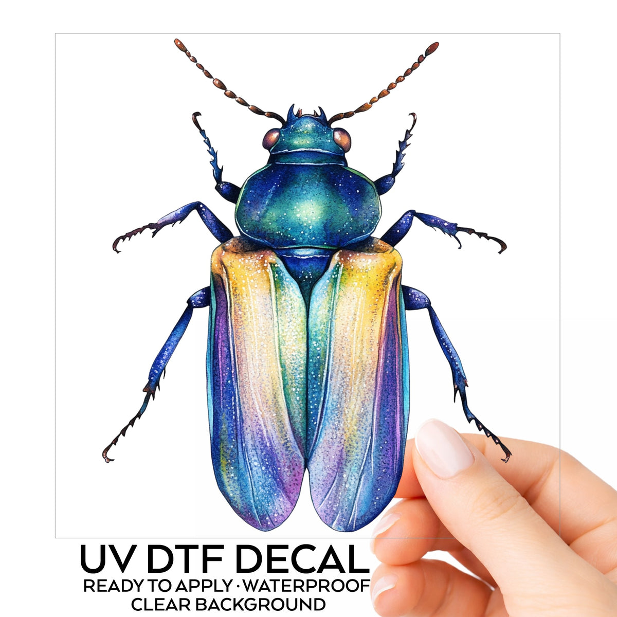 Gold And Blue Jewel Beetle UV DTF sticker on its backing card, held in hand