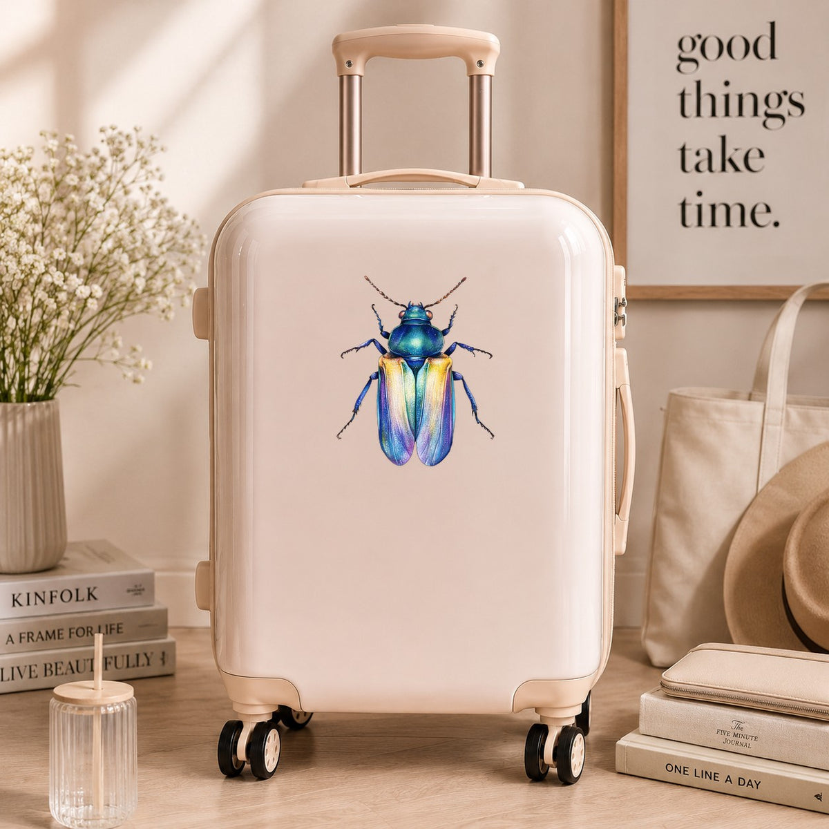 Gold And Blue Jewel Beetle UV DTF sticker applied to a cream carry-on suitcase