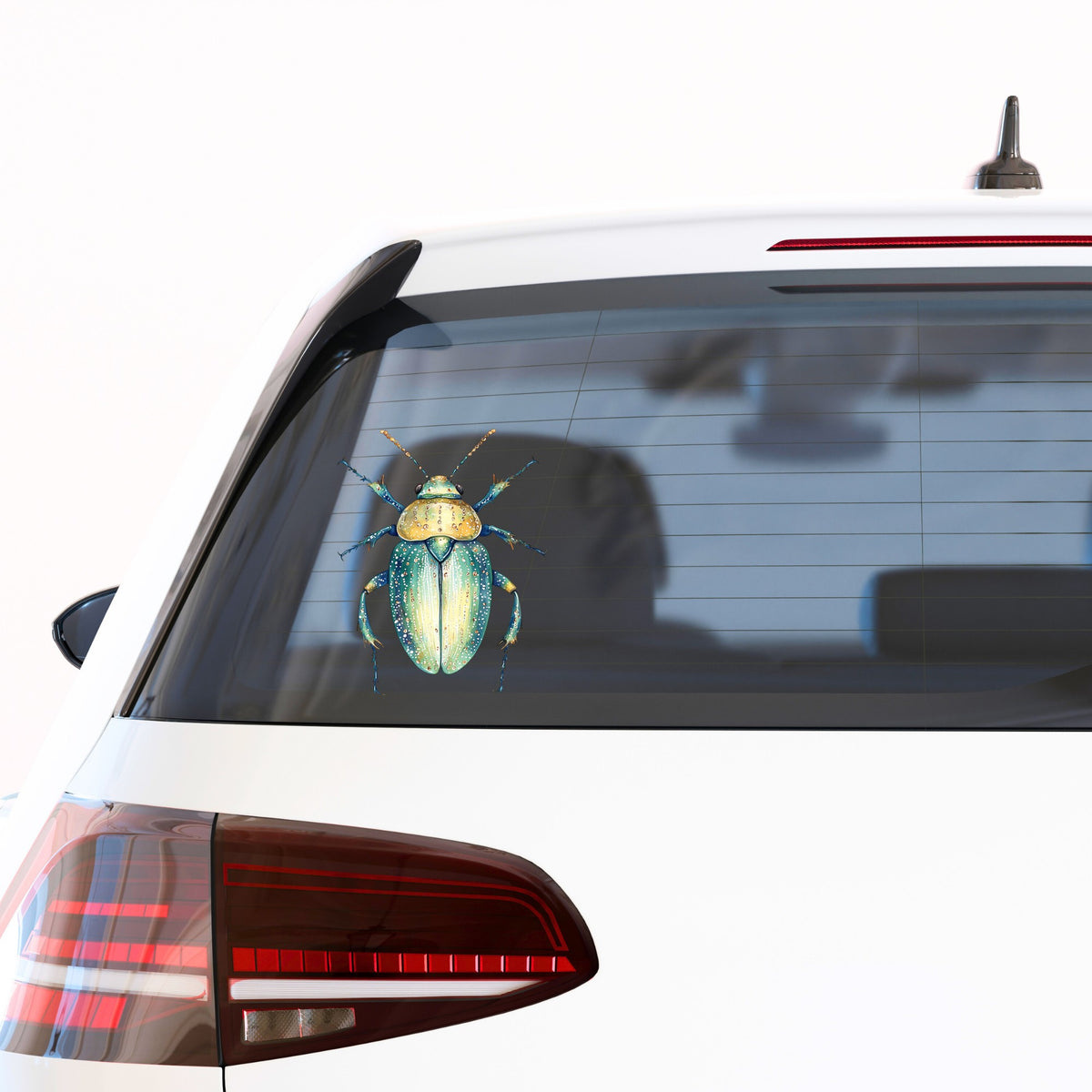 White Dotted Teal Beetle UV DTF sticker applied to the rear window of a white car