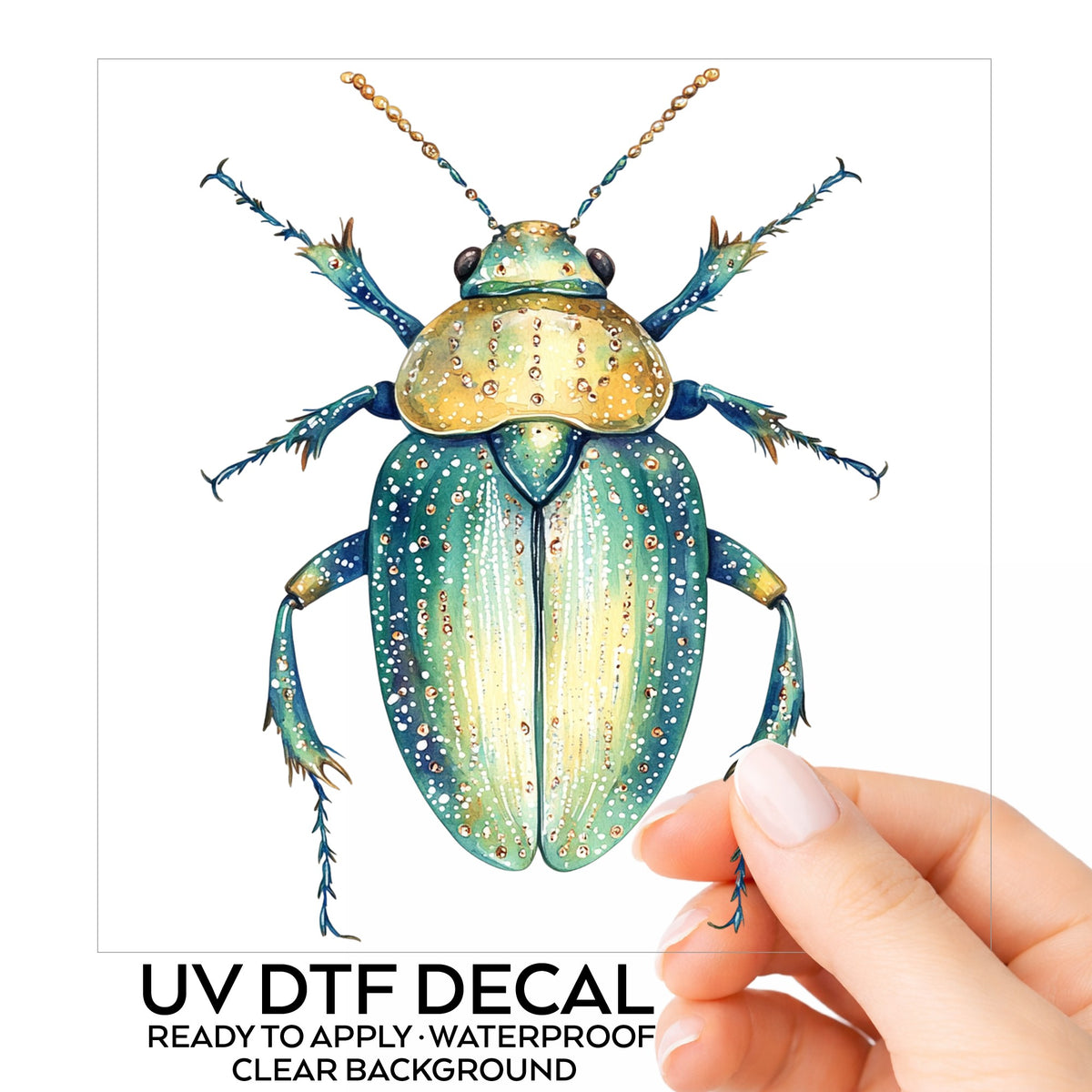 White Dotted Teal Beetle UV DTF sticker on its backing card, held in hand