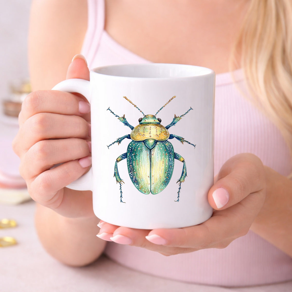 White Dotted Teal Beetle UV DTF sticker applied to a white coffee mug held in both hands