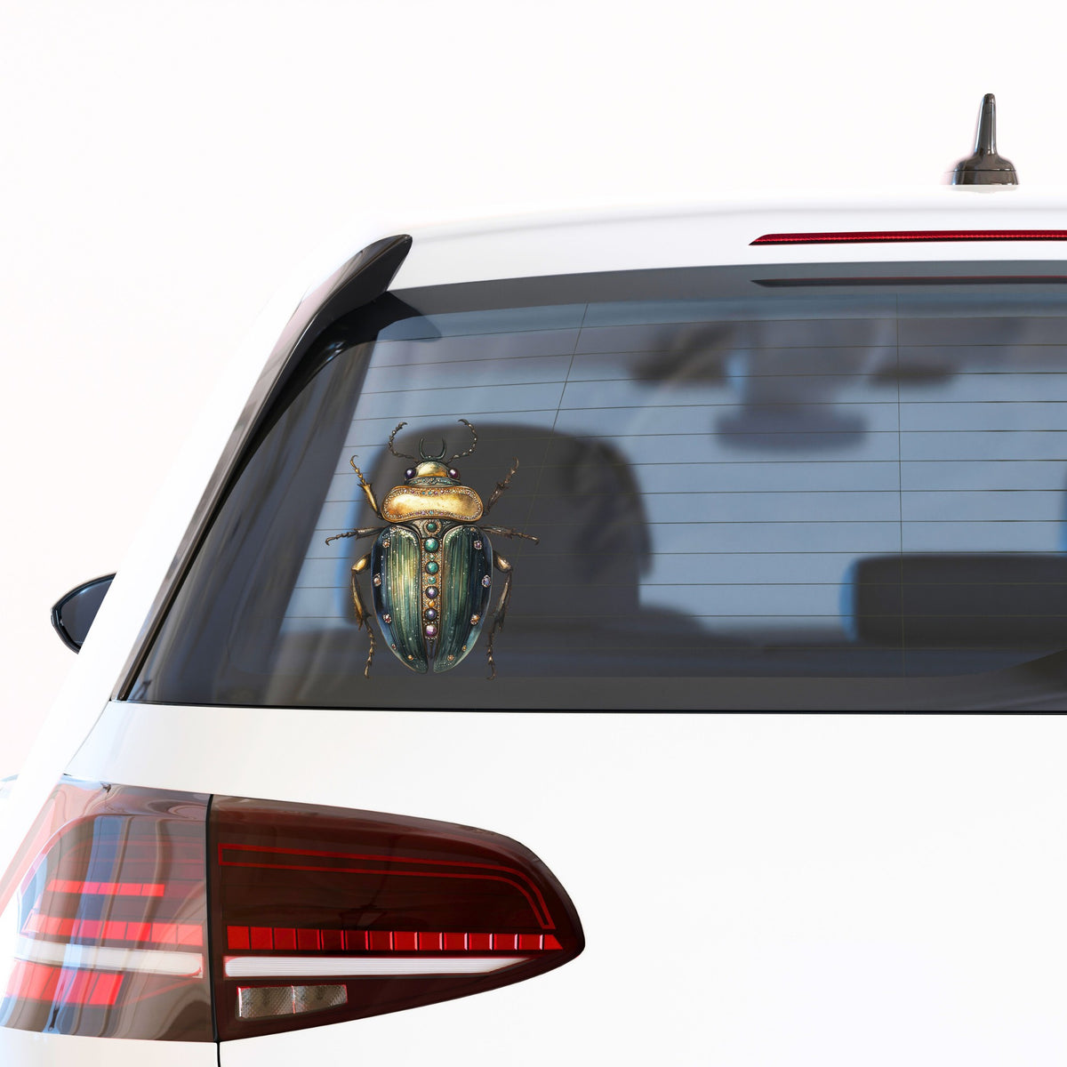 Jeweled Gold Scarab Beetle UV DTF sticker applied to the rear window of a white car