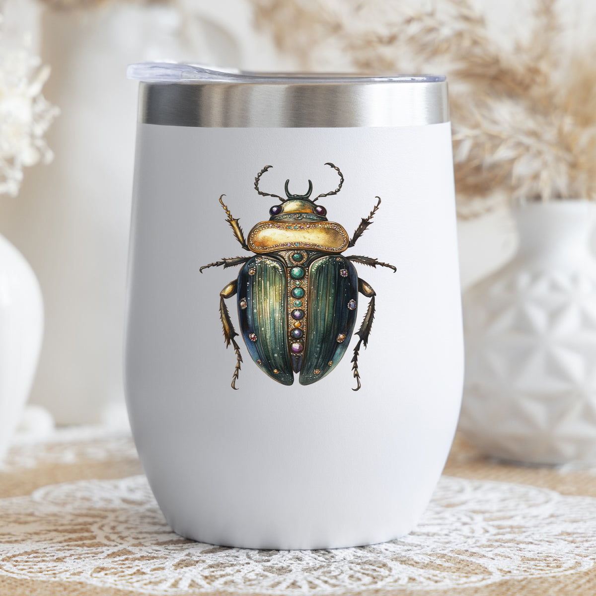 Jeweled Gold Scarab Beetle UV DTF sticker applied to a white stemless tumbler with a lid